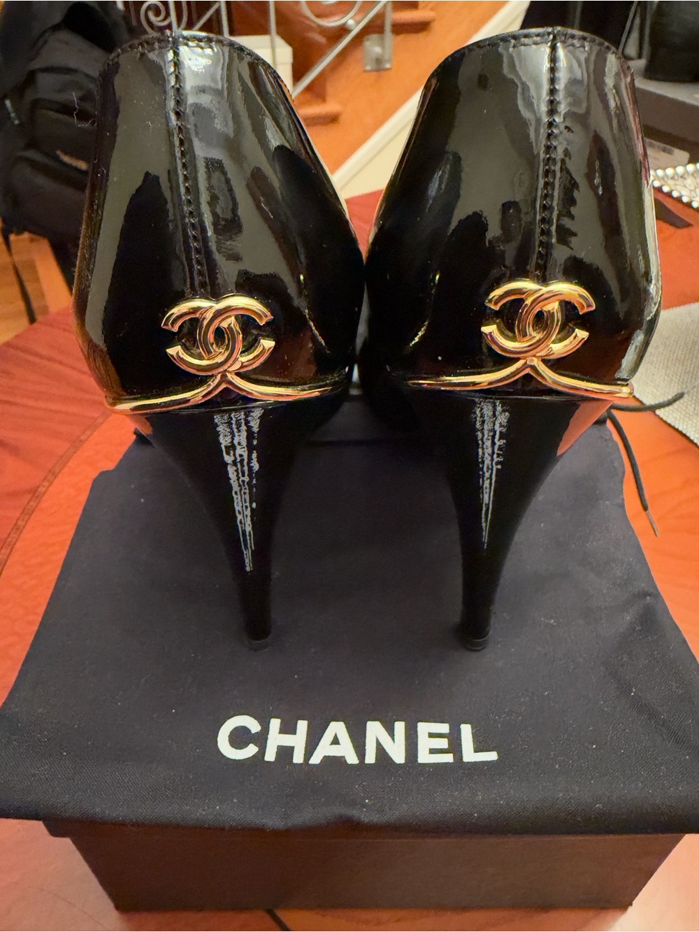 CHANEL Black Patent Leather Stiletto Heels with Gold CC Hardware